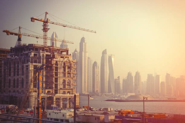 construction of a new building in dubai with city skyline